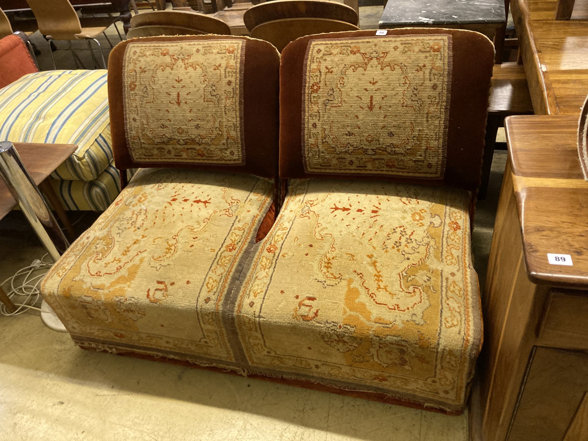 A Victorian carpet upholstered conversation seat with hinged adjustable back rests, length 134cm, depth 86cm, height 84cm
